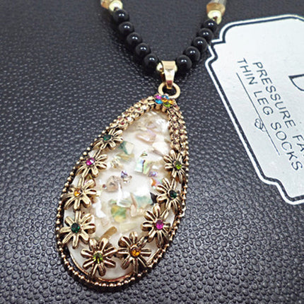 European and American ethnic style imitation beeswax color shell long sweater chain autumn and winter retro water drop necklace jewelry wholesale