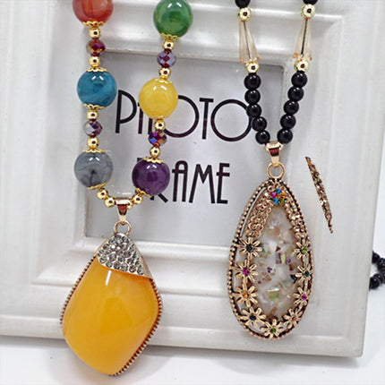 European and American ethnic style imitation beeswax color shell long sweater chain autumn and winter retro water drop necklace jewelry wholesale