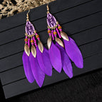 Purple feather earrings
