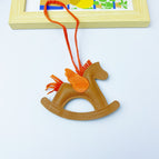 Brown rocking horse bag pendant