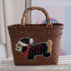 Brown bamboo handle black hat dog