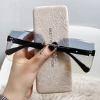 blue tea in black gold frame / Sunglasses