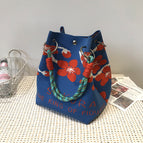 Blue background cherry blossom handbag