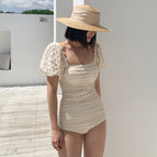 Beige one-piece / M