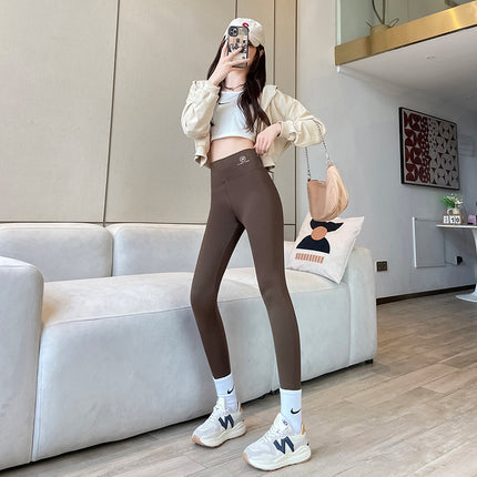 Source: Yiwu Wholesale Ice Silk Thin Yoga Leggings, Airplane Logo, High Waist, Tummy Control, Slimming, Outerwear, Nine-Point Drop Shipping