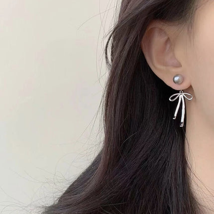 925 Silver Needle Korean and Japanese Summer Faux Pearl Bowknot Earrings Simple French Style Versatile 2026 New Women's Earrings
