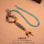 Three-eyed dzi bead