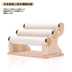 Golden three-layer bracelet stand white leather (solid wood stand)