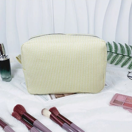 etsy hot selling seersucker embroidered striped cosmetic bag for travel portable toilet storage cosmetic bag