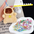 About 11cm high / Light brown gold bell + a random color bead chain