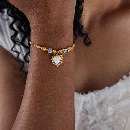 Antique European and American titanium steel vacuum plating 18k gold non-fading round heart pendant bracelet women's wholesale jewelry