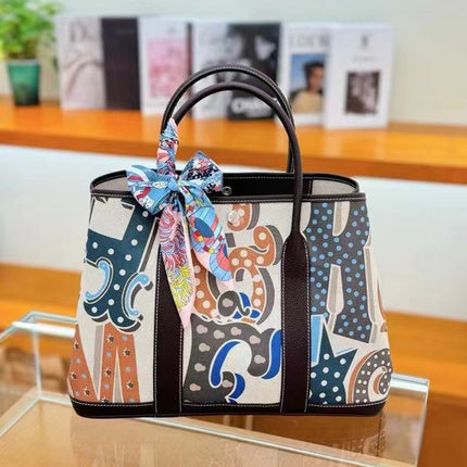 2025 New Canvas Top Layer Cowhide Women's Bag Garden Handbag Large Capacity Genuine Leather Contrast Shoulder Tote Bag