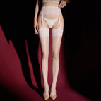 Pink / Aurora [blowing a kiss and a garter]