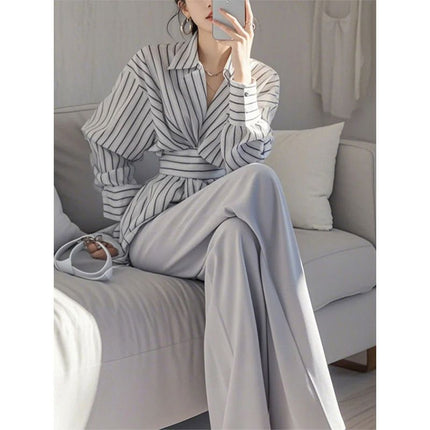 In spring, wear a set of salt-based, light-cooked and capable, elegant, A- and-gray striped shirt, professional suit pants