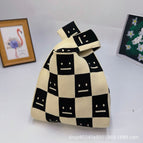Smiley face beige black