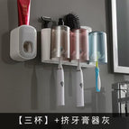 3 cups gray and white toothpaste squeezer