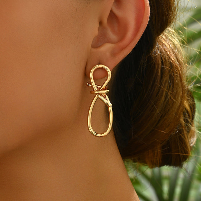 European and American alloy cross-border simple Hong Kong style 8-character twisted winding long ear buckle creative personality butterfly knot earrings