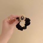 Black [rose] hair tie