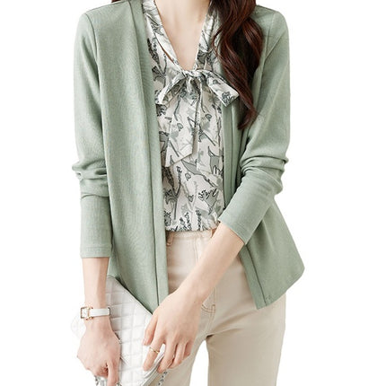 In the spring of 2025, the new style fake two-piece sweater women's design is small and chic green top.
