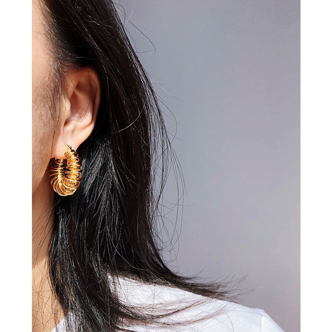 Brass gold plated European and American personality spiral Hollow spring earrings winding line POHO big ear ring earrings 553