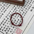 Single bell burgundy bracelet