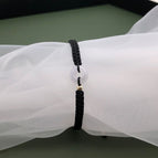 White safety buckle braided black bracelet