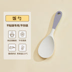 Gray and white rice spoon