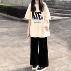 7916 apricot top + black pants / XS