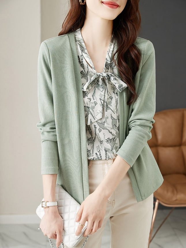 In the spring of 2025, the new style fake two-piece sweater women's design is small and chic green top.