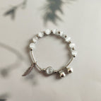 Silver Feather [a circle of White]]