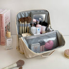 Upgraded stand-up cosmetic bag-beige / Logo random