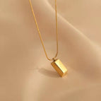 Small gold brick necklace