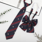 Dark blue badge (tie + collar flower)