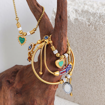 Antique European and American titanium steel vacuum plating 18k gold non-fading round heart pendant bracelet women's wholesale jewelry