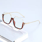 Tortoiseshell gold frame transparent lens