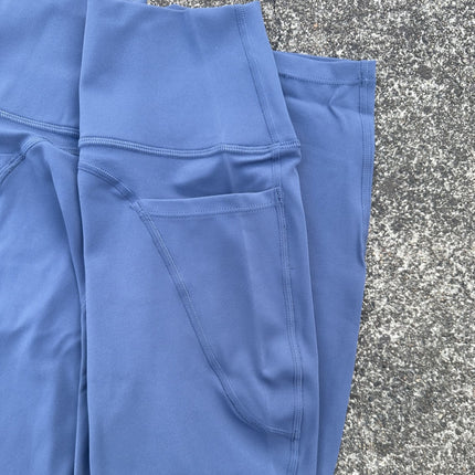 Solid color high luxury brushed Lycra fitness leggings cross-border European and American high waist peach hip yoga pants side pocket women