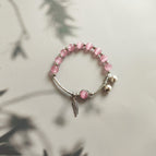 Silver Feather [a circle of pink]]