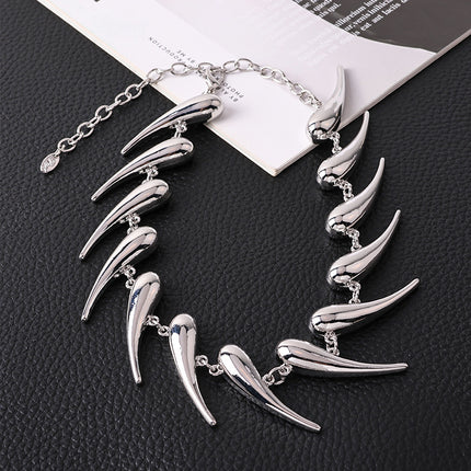 AliExpress cross-border European and American thorns stitching water drop pendant necklace exaggerated smooth comma pepper-shaped alloy necklace