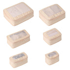 A set of shandong silk beige compression bags