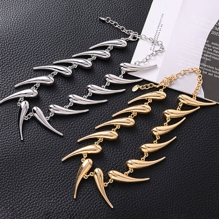 AliExpress cross-border European and American thorns stitching water drop pendant necklace exaggerated smooth comma pepper-shaped alloy necklace