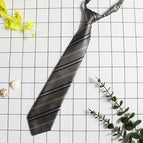 Grey pliers gold tie
