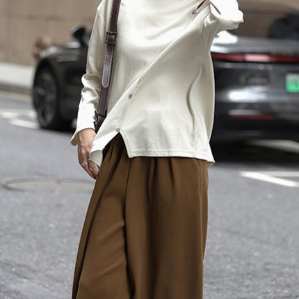Light oxygen sense sweater 2025 spring temperament round neck oblique split fake placket design long sleeve sweater women