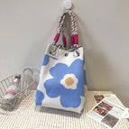 Beige and blue floral handbag