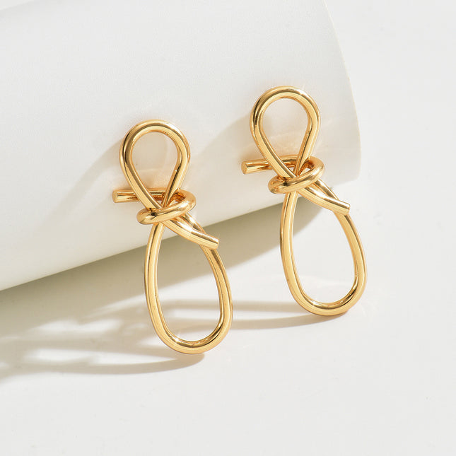 European and American alloy cross-border simple Hong Kong style 8-character twisted winding long ear buckle creative personality butterfly knot earrings