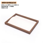 Black walnut grain jewelry plate and white leather necklace (height 3cm)