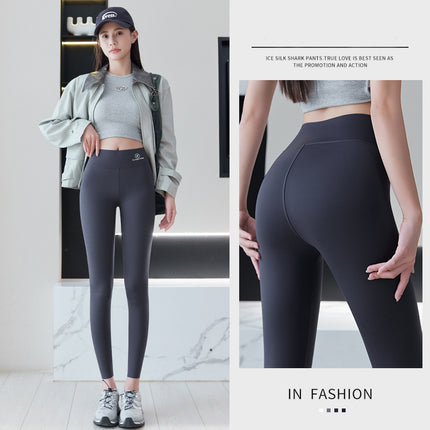 Source: Yiwu Wholesale Ice Silk Thin Yoga Leggings, Airplane Logo, High Waist, Tummy Control, Slimming, Outerwear, Nine-Point Drop Shipping