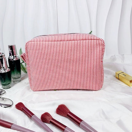 etsy hot selling seersucker embroidered striped cosmetic bag for travel portable toilet storage cosmetic bag