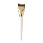 White handle gold fishtail brush