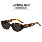 Tortoiseshell framed black and gray pieces