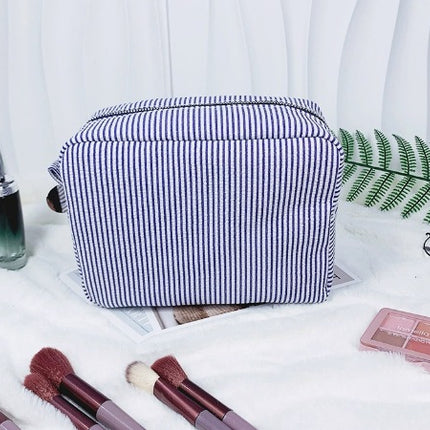 etsy hot selling seersucker embroidered striped cosmetic bag for travel portable toilet storage cosmetic bag